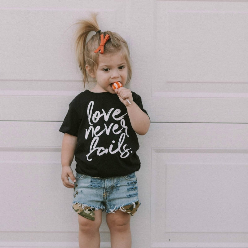 Love Never Fails Girls Christian Heart Shirt